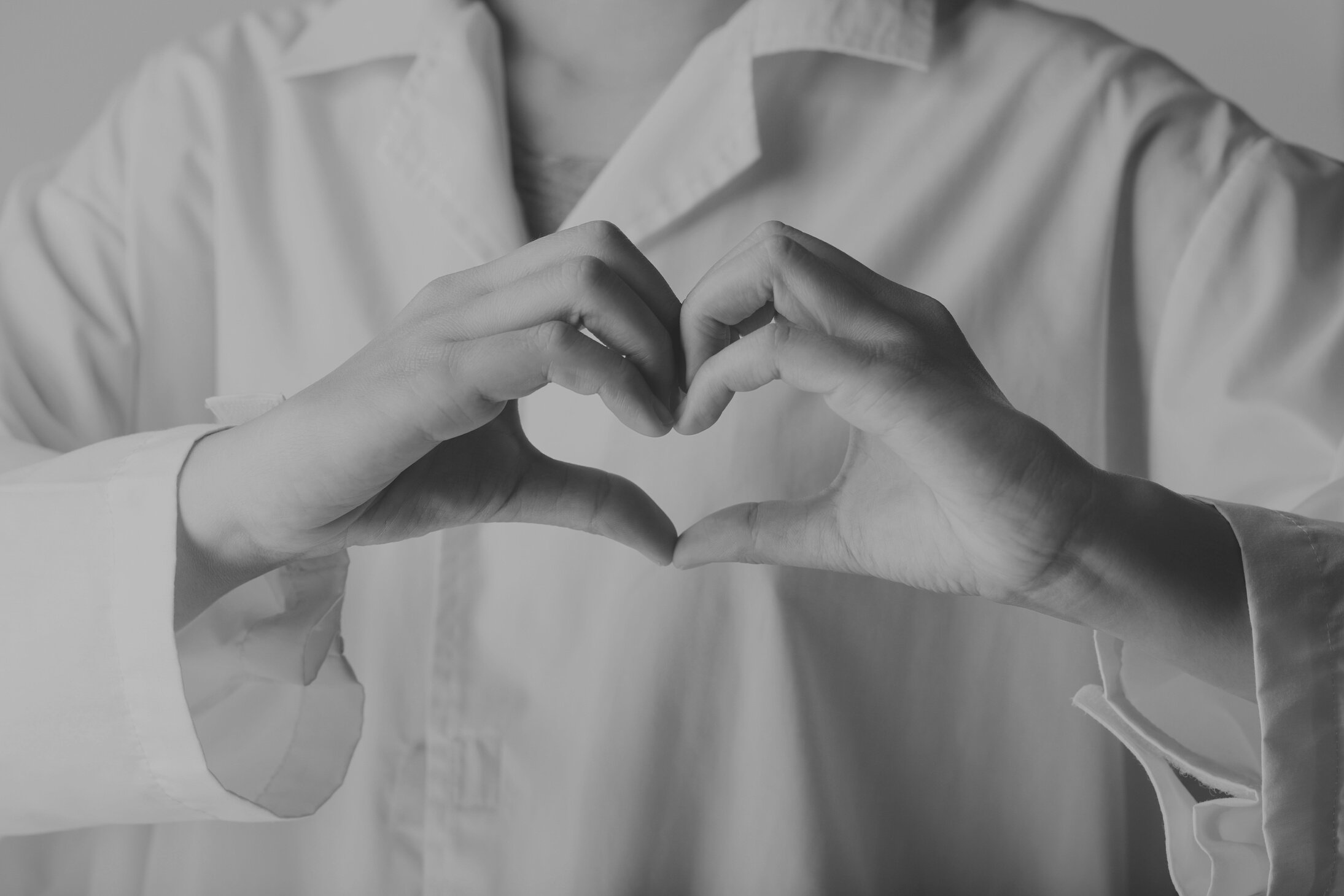 Doctor in White Coat Shirt Making Hands in Heart Shape